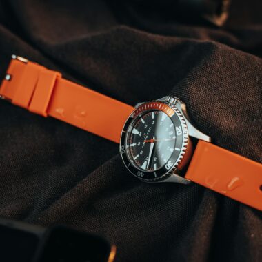 A stylish wristwatch with an orange strap, ideal for fashion and luxury enthusiasts.